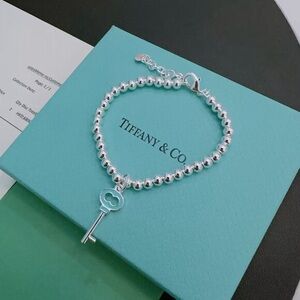 Tiffany & Co. Silver Bracelet with Key Charm